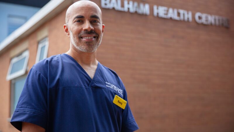 Portrait of Dr Sanj Satheesan community special care dentist outside a health centre
