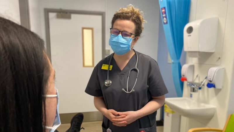 A cancer nurse at Kingston Hospital talking to a patient