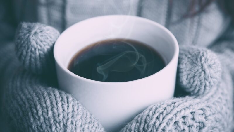 Winter gloves and hot drink